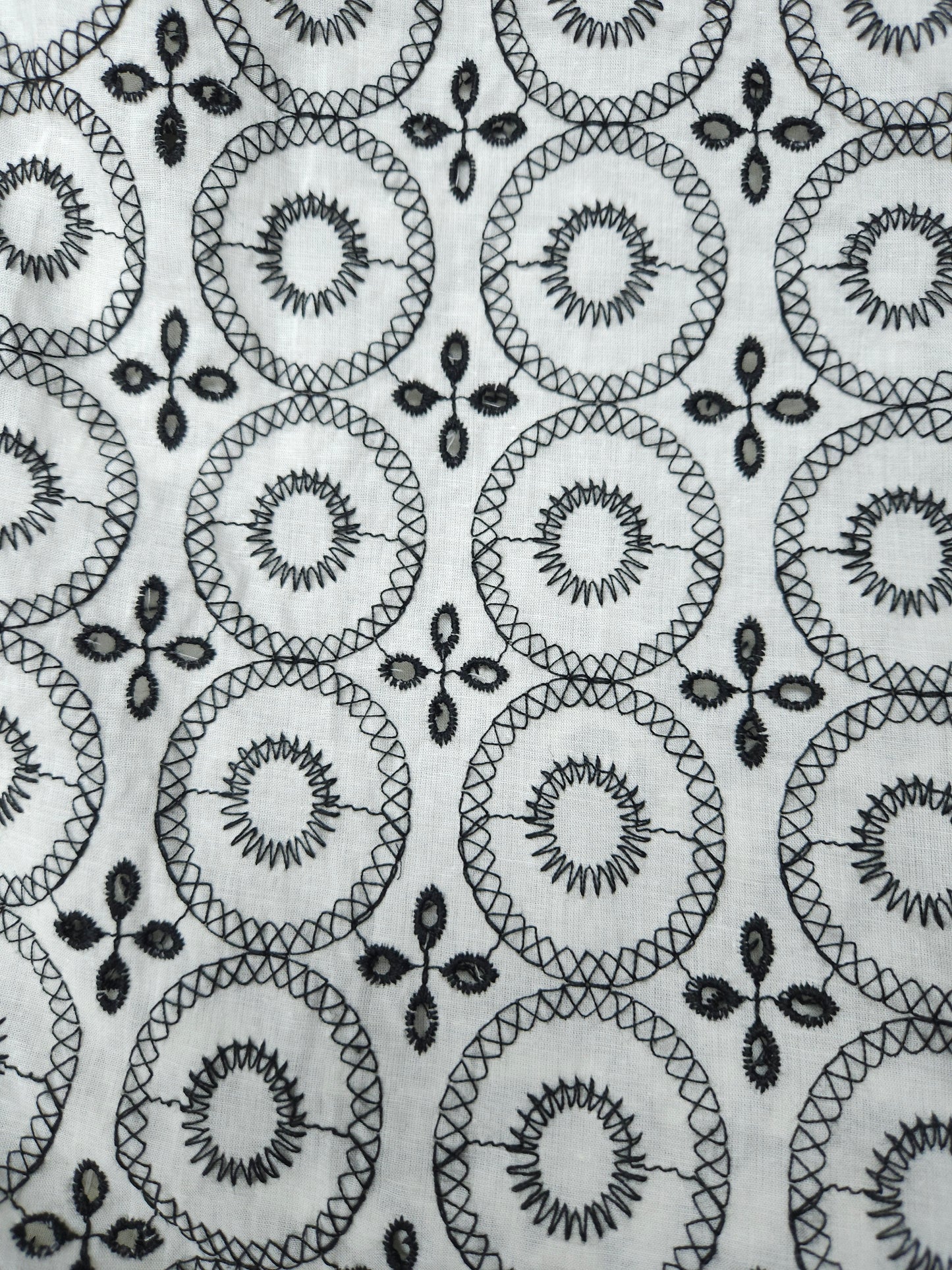 Black on white 100% cotton fabric with Schifli work
