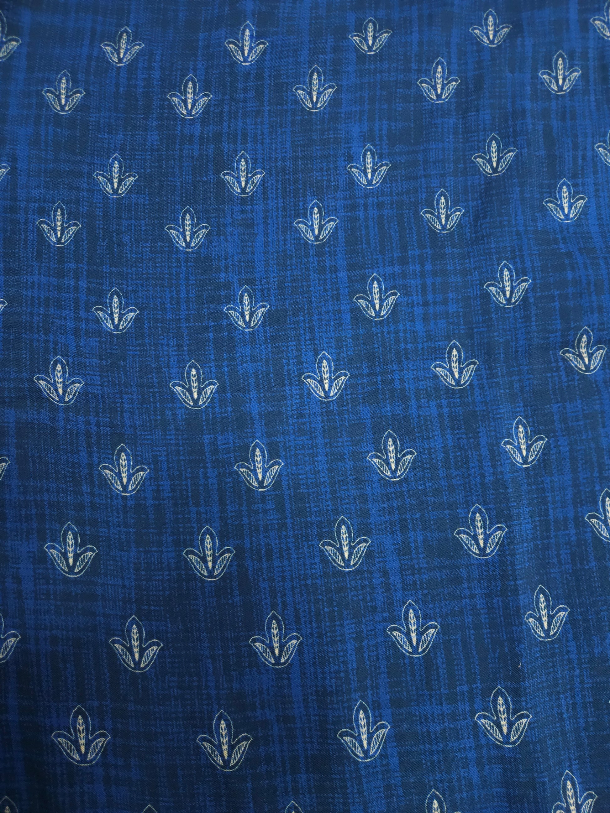 Blue fabric with white floral patterns