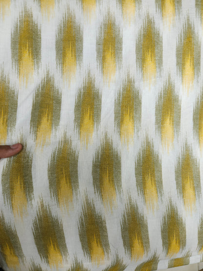 Close-up of fabric with a yellow and green pattern