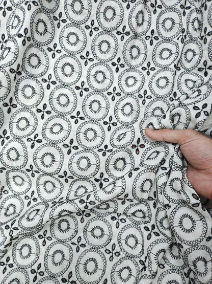 Black on white 100% cotton fabric with Schifli work