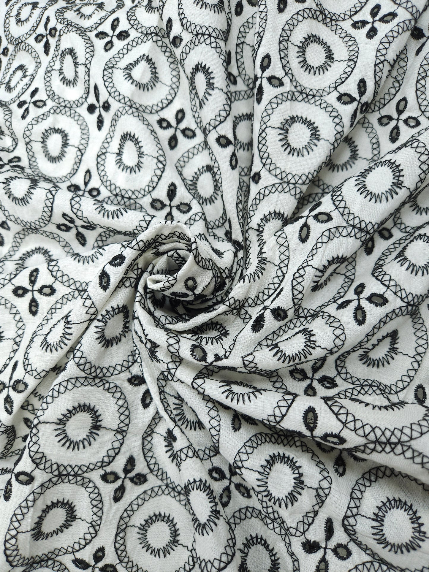 Black on white 100% cotton fabric with Schifli work