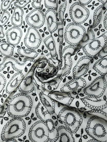 Black on white 100% cotton fabric with Schifli work