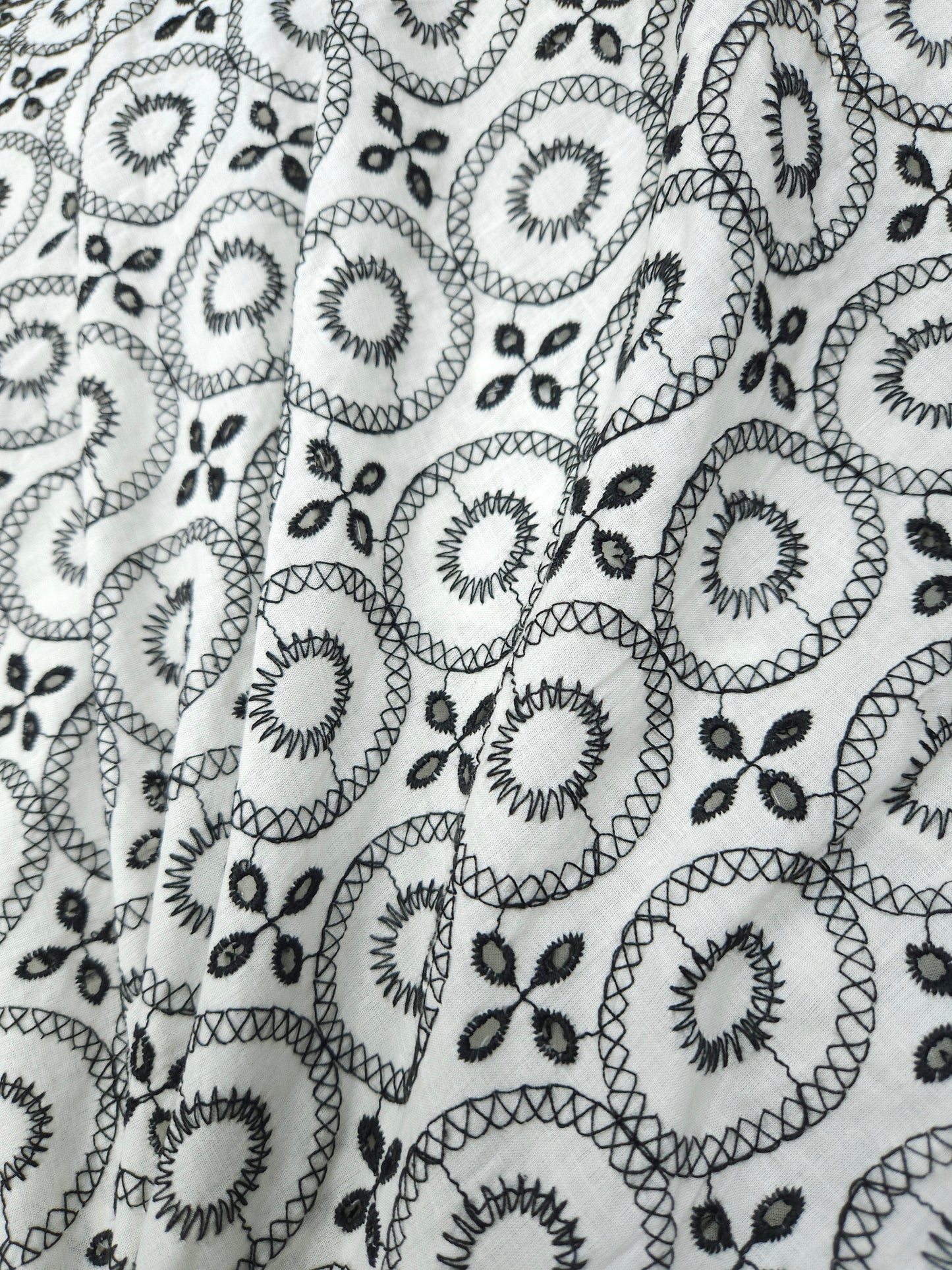 Black on white 100% cotton fabric with Schifli work