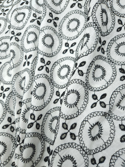 Black on white 100% cotton fabric with Schifli work