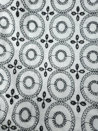 Black on white 100% cotton fabric with Schifli work