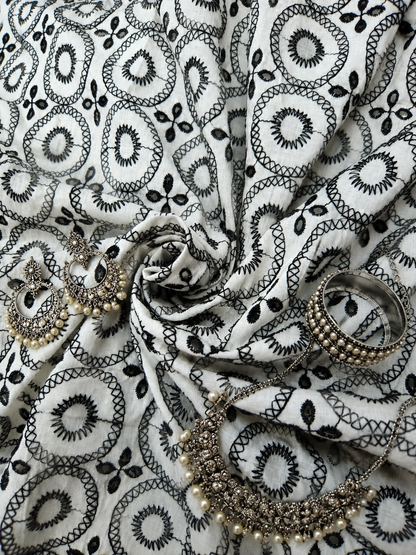 Black on white 100% cotton fabric with Schifli work