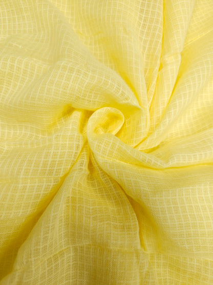 Close-up of yellow fabric with a textured pattern